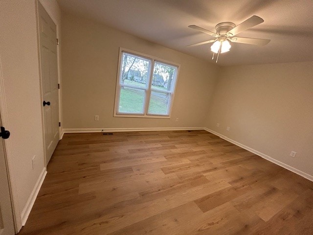 unfurnished room with ceiling fan and light hardwood / wood-style flooring