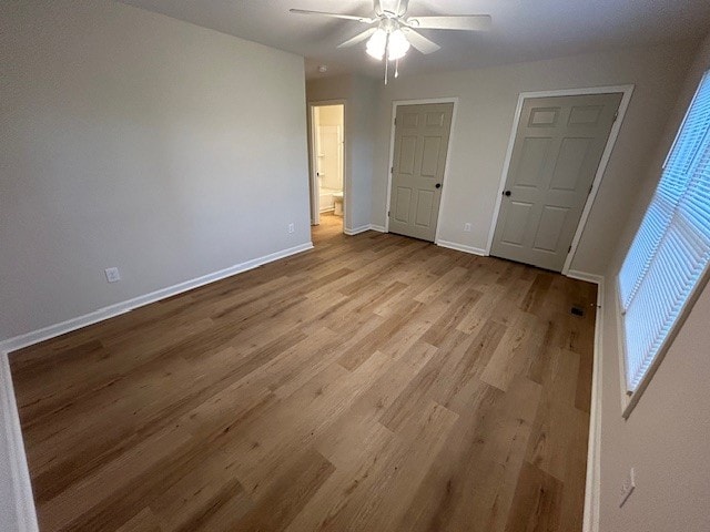 unfurnished bedroom featuring light hardwood / wood-style floors and ceiling fan