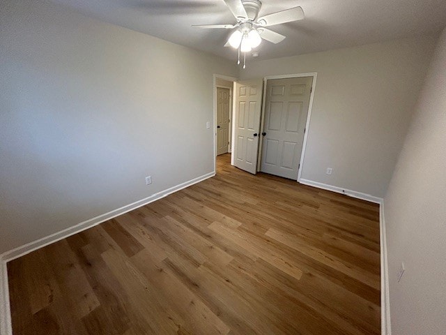 spare room featuring ceiling fan and light wood-type flooring