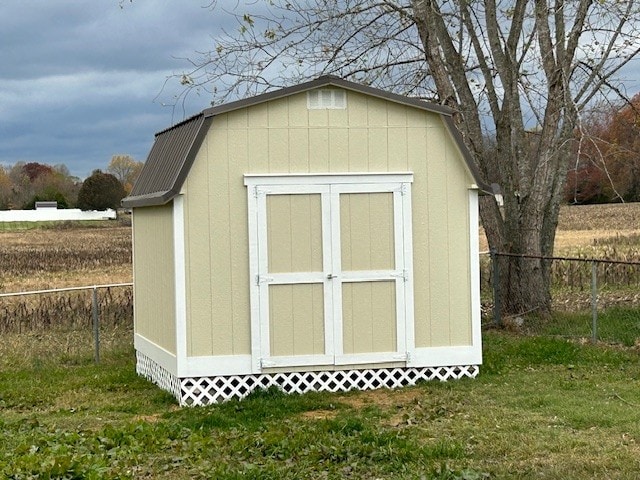 view of outbuilding with a lawn