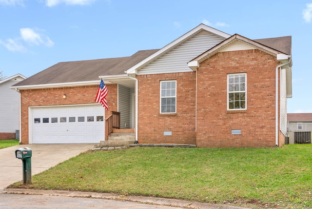 view of front of property featuring a front lawn and a garage