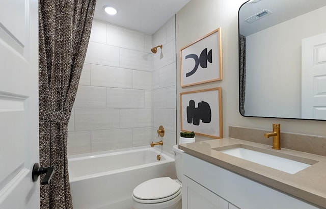 full bathroom with toilet, vanity, and shower / bath combination with curtain