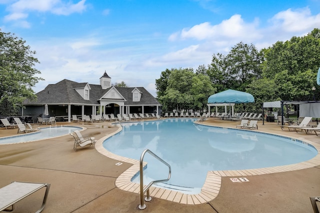 view of swimming pool featuring a patio