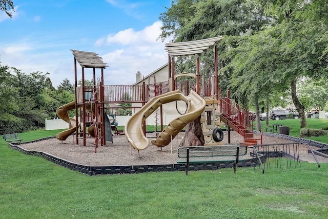 view of jungle gym featuring a lawn