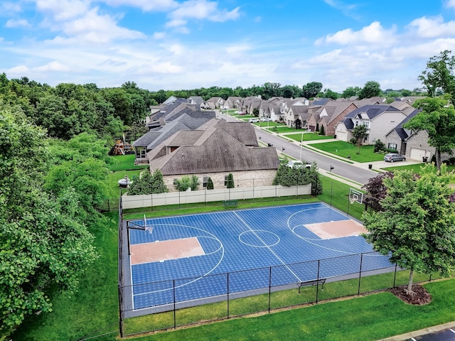 view of basketball court featuring a lawn