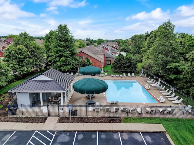 view of swimming pool featuring a patio area