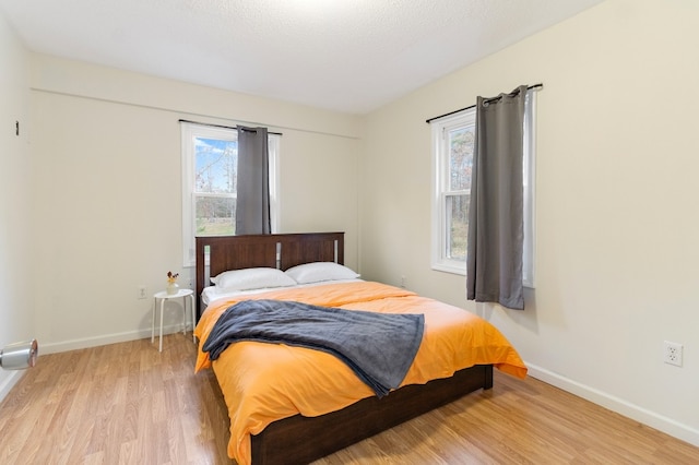 bedroom featuring light wood-type flooring