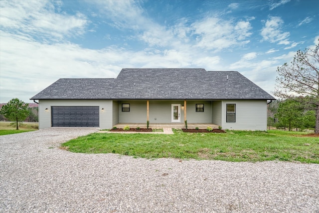 single story home with covered porch and a garage