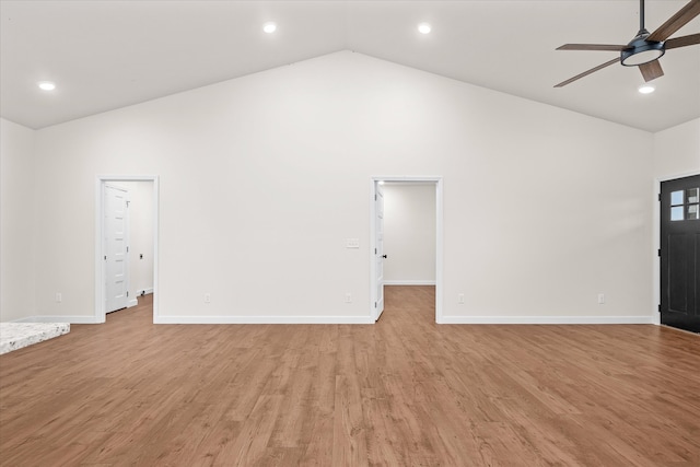 unfurnished living room featuring ceiling fan, high vaulted ceiling, and light hardwood / wood-style floors