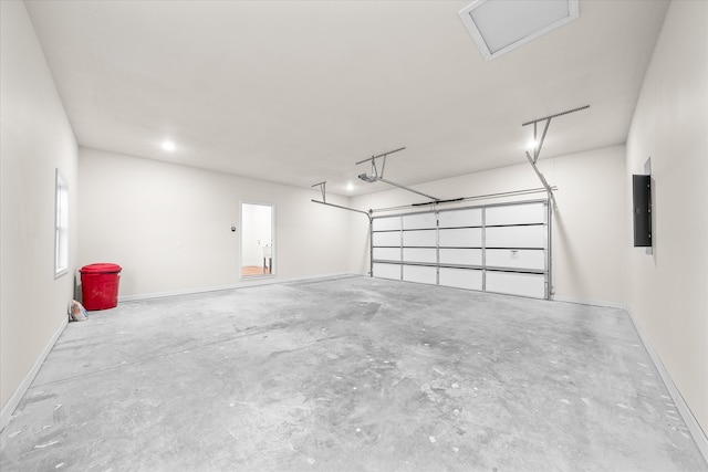 garage featuring a garage door opener and electric panel