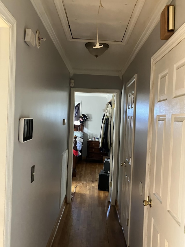 corridor featuring dark hardwood / wood-style flooring and ornamental molding