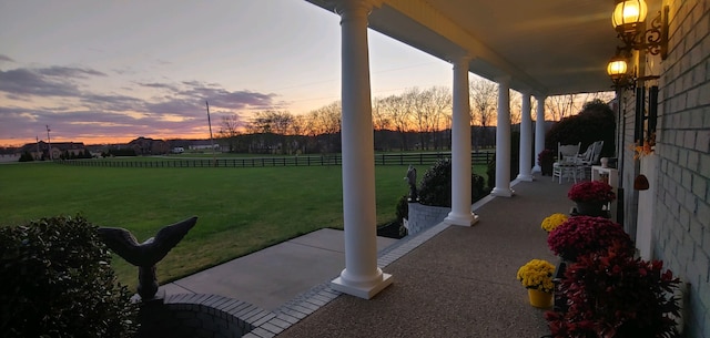 patio terrace at dusk with a lawn