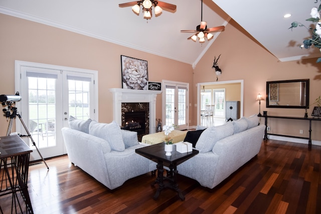 living room with dark wood-type flooring, french doors, and ornamental molding