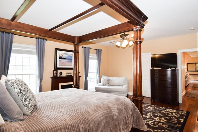 bedroom featuring ceiling fan, beamed ceiling, and hardwood / wood-style flooring