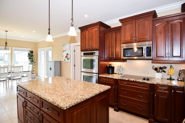 kitchen with light stone countertops, hanging light fixtures, stainless steel appliances, light tile patterned floors, and ornamental molding