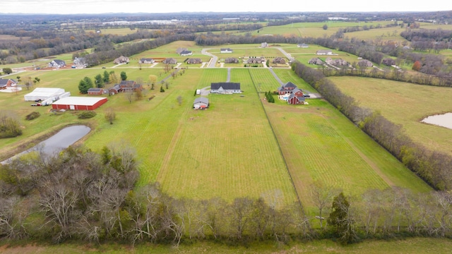 birds eye view of property featuring a rural view