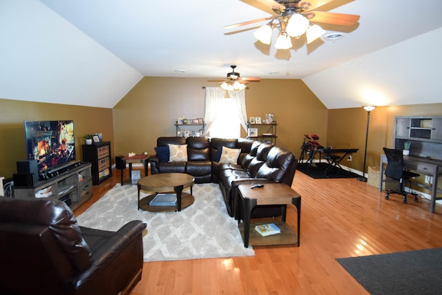 living room with lofted ceiling, ceiling fan, and hardwood / wood-style flooring