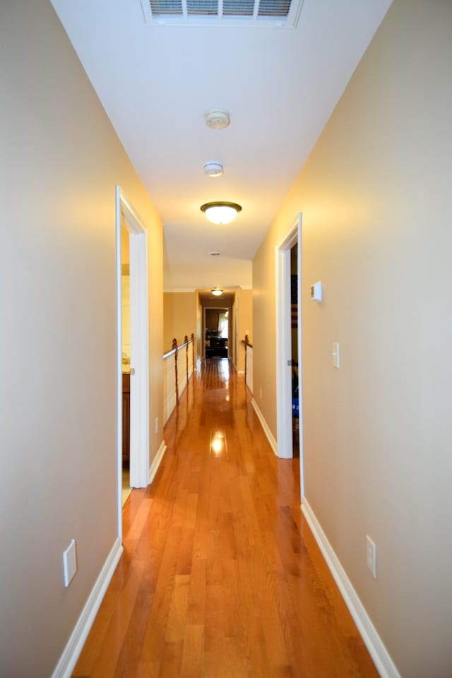 corridor featuring light hardwood / wood-style floors