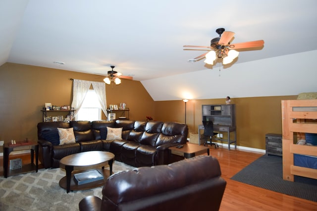 living room with vaulted ceiling, ceiling fan, and wood-type flooring