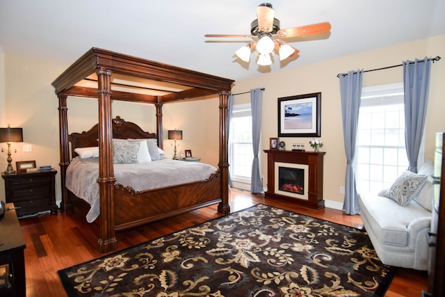 bedroom featuring ceiling fan and dark hardwood / wood-style flooring