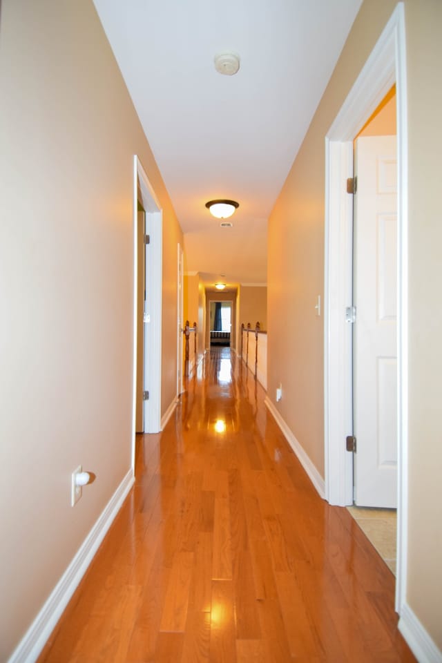 hall with wood-type flooring