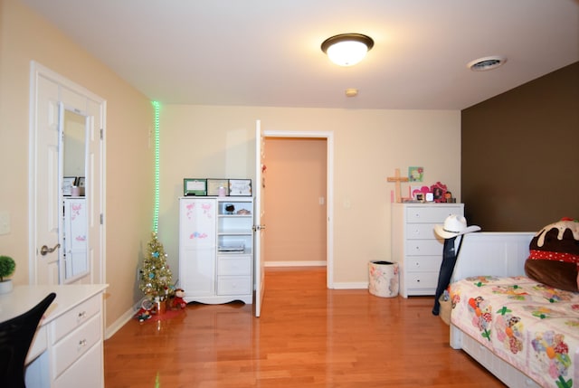 bedroom with light hardwood / wood-style flooring