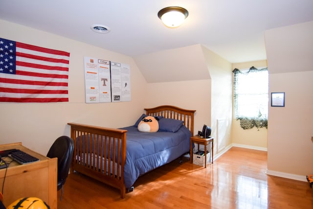 bedroom with wood-type flooring