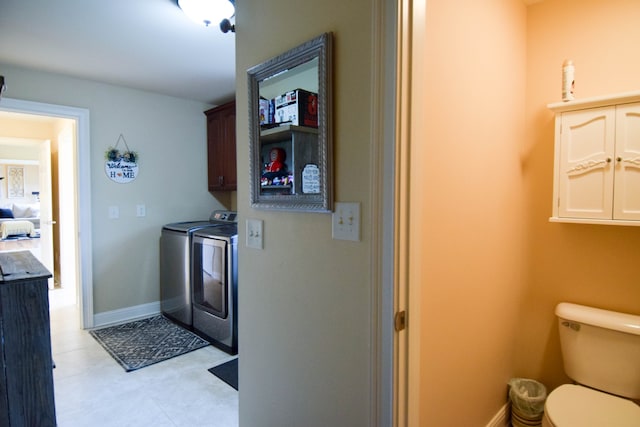 kitchen featuring dark brown cabinets and washing machine and clothes dryer