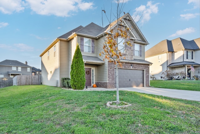 view of front of home featuring a garage and a front lawn