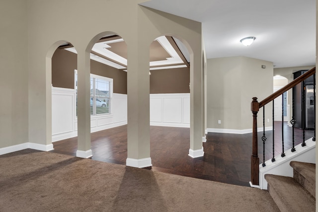 entryway with dark colored carpet