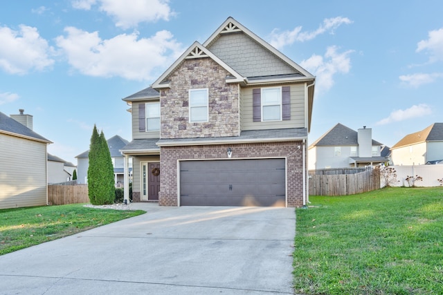 view of front of home featuring a garage and a front yard