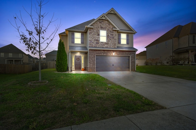 view of front facade featuring a yard and a garage