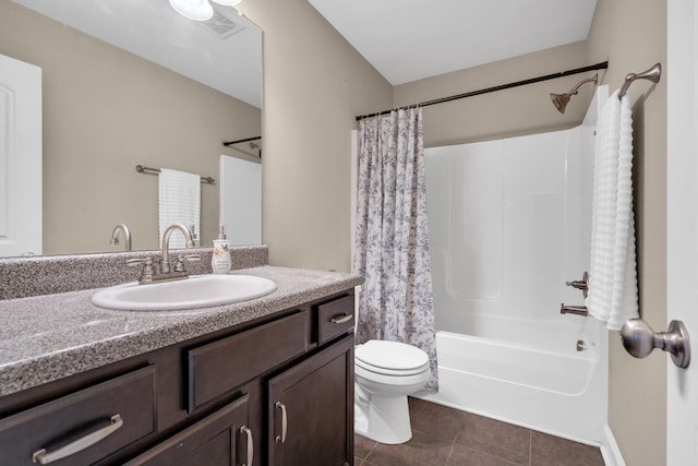 full bathroom with tile patterned flooring, vanity, shower / bath combo, and toilet