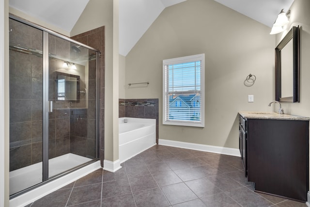 bathroom with tile patterned floors, vanity, lofted ceiling, and shower with separate bathtub