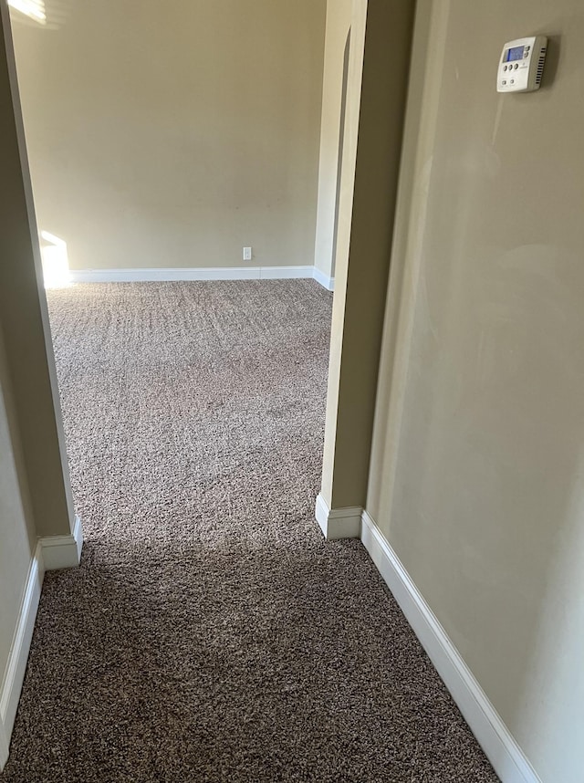 hall with carpet flooring