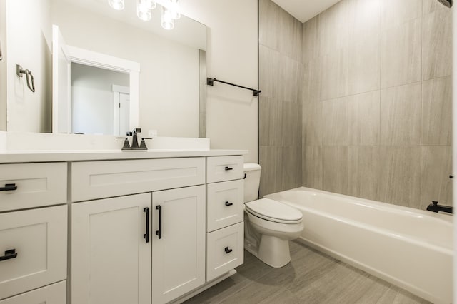 full bathroom with vanity, shower / bath combination, and toilet