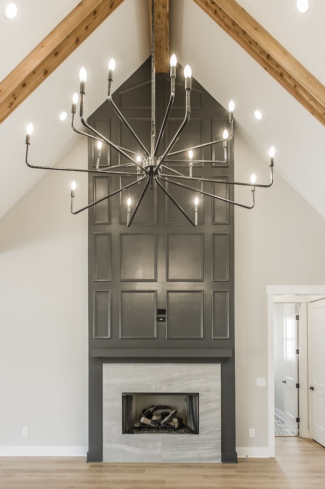 room details featuring beamed ceiling and hardwood / wood-style floors