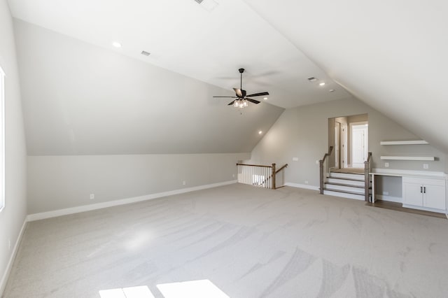 bonus room with light colored carpet, ceiling fan, and lofted ceiling