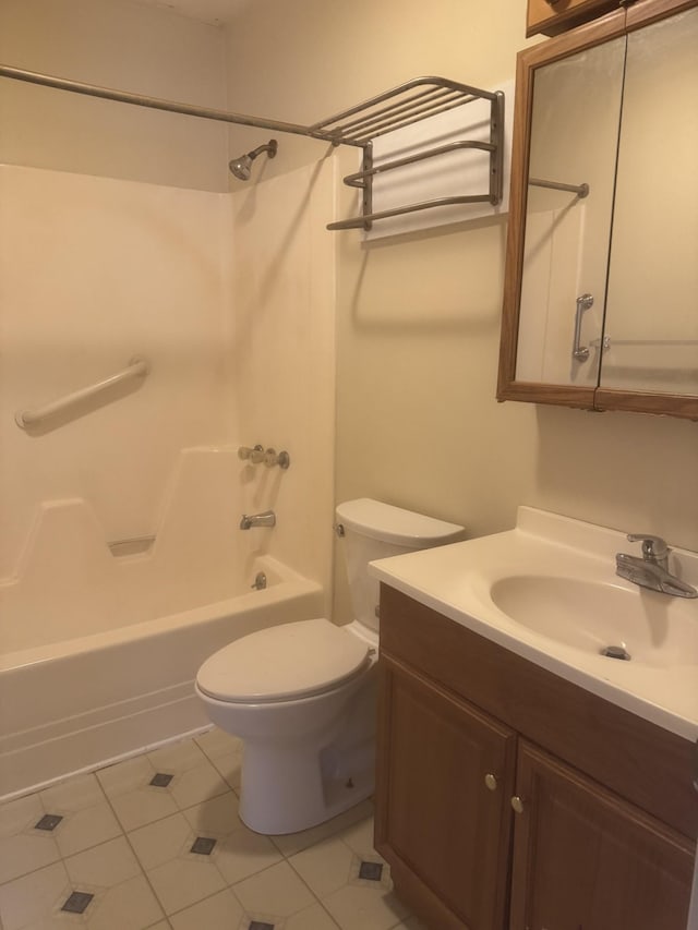 full bathroom featuring tile patterned floors, vanity, toilet, and bathing tub / shower combination