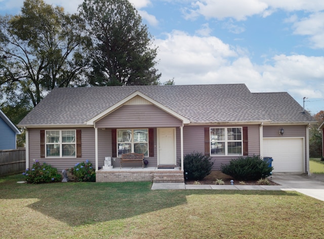 ranch-style home featuring a front yard, a porch, and a garage