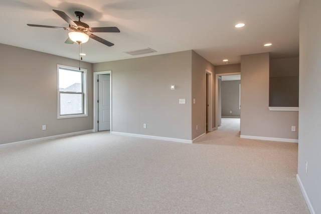 empty room with light carpet and ceiling fan