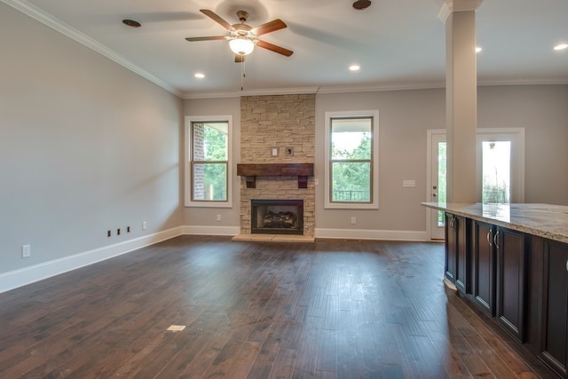 unfurnished living room with dark hardwood / wood-style floors, plenty of natural light, and crown molding