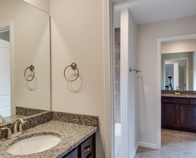 bathroom featuring tile patterned flooring and vanity