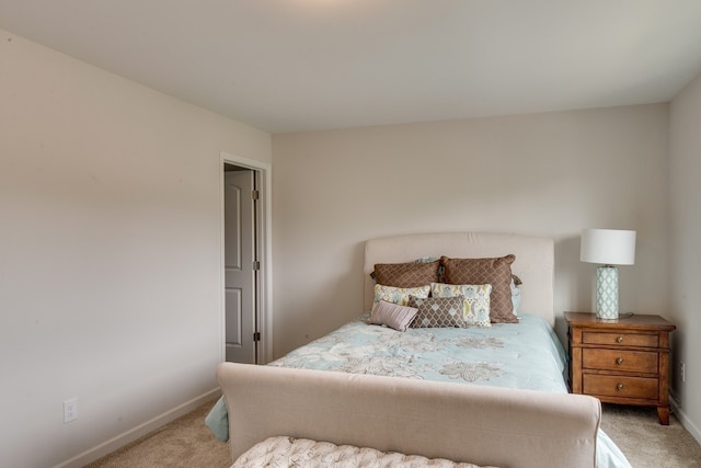 bedroom with light colored carpet