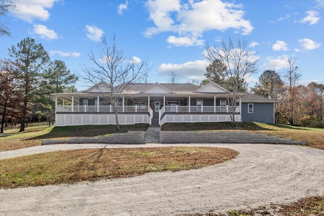 view of front facade with a front lawn and a porch