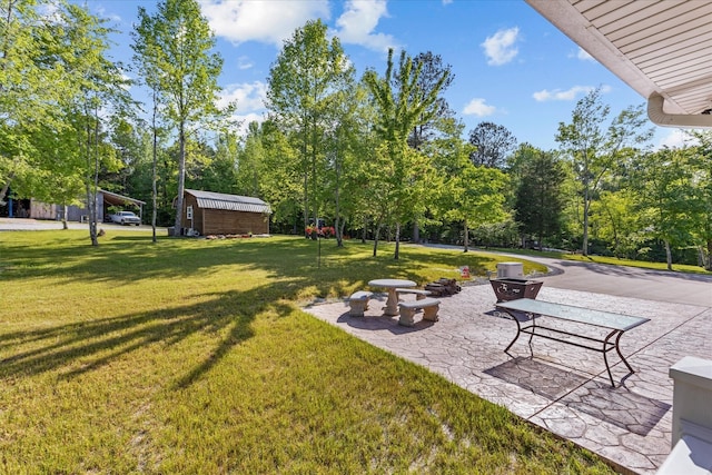 view of yard with a patio area and a shed