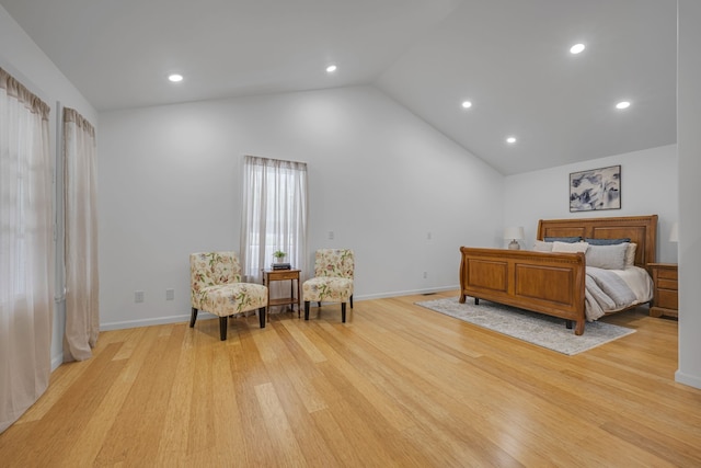 bedroom featuring light hardwood / wood-style flooring and vaulted ceiling