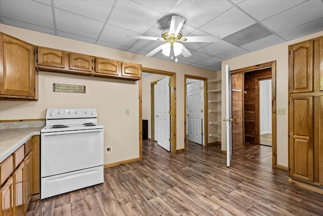 kitchen featuring white electric range, a drop ceiling, dark wood-type flooring, and ceiling fan