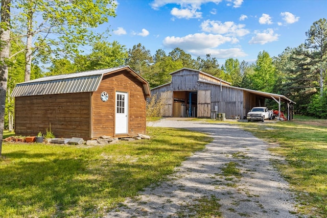 view of outbuilding with a yard