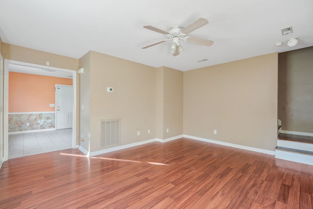 empty room featuring light wood-type flooring and ceiling fan